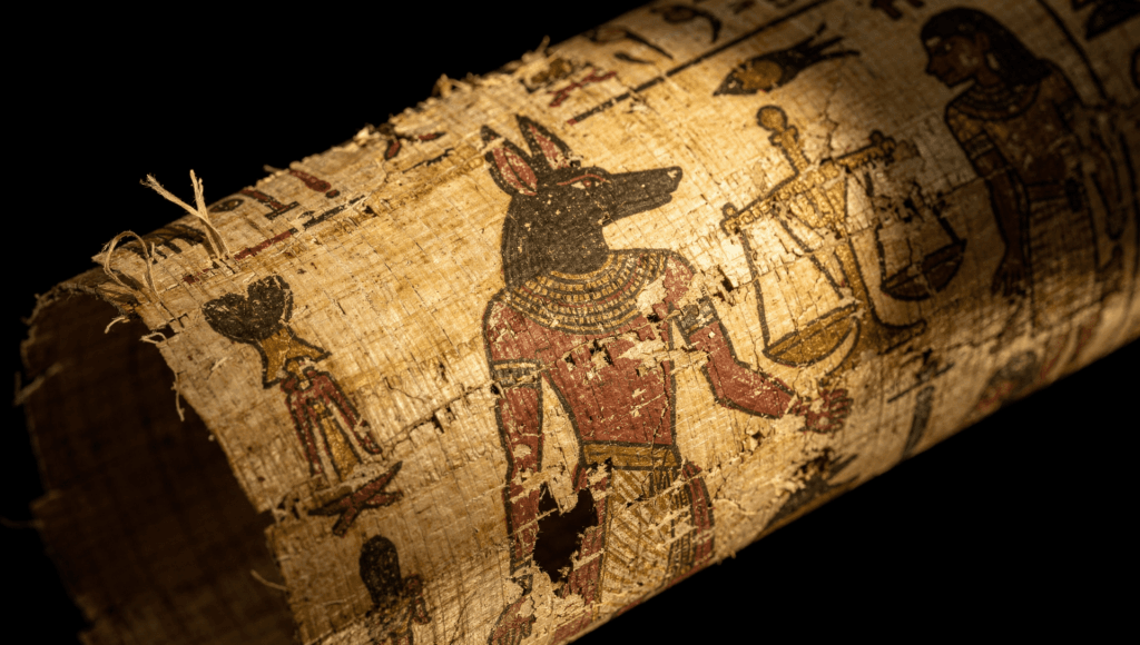 Book of the Dead papyrus showing Anubis beside the scale in the judgment scene