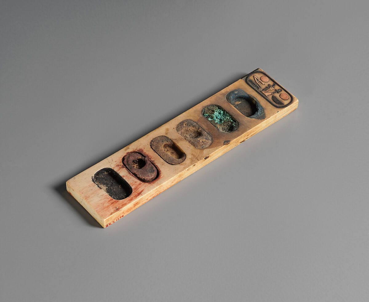 Ivory painter’s palette with six oval pigment wells and an inscription at one end