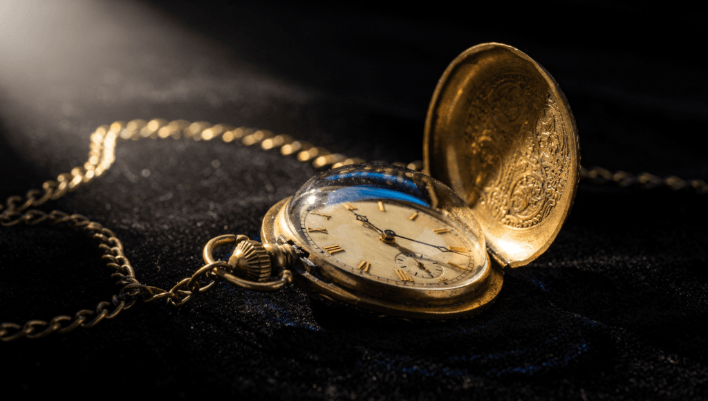 Repeating numbers as a sign from a loved one: a gold pocket watch showing 11:11